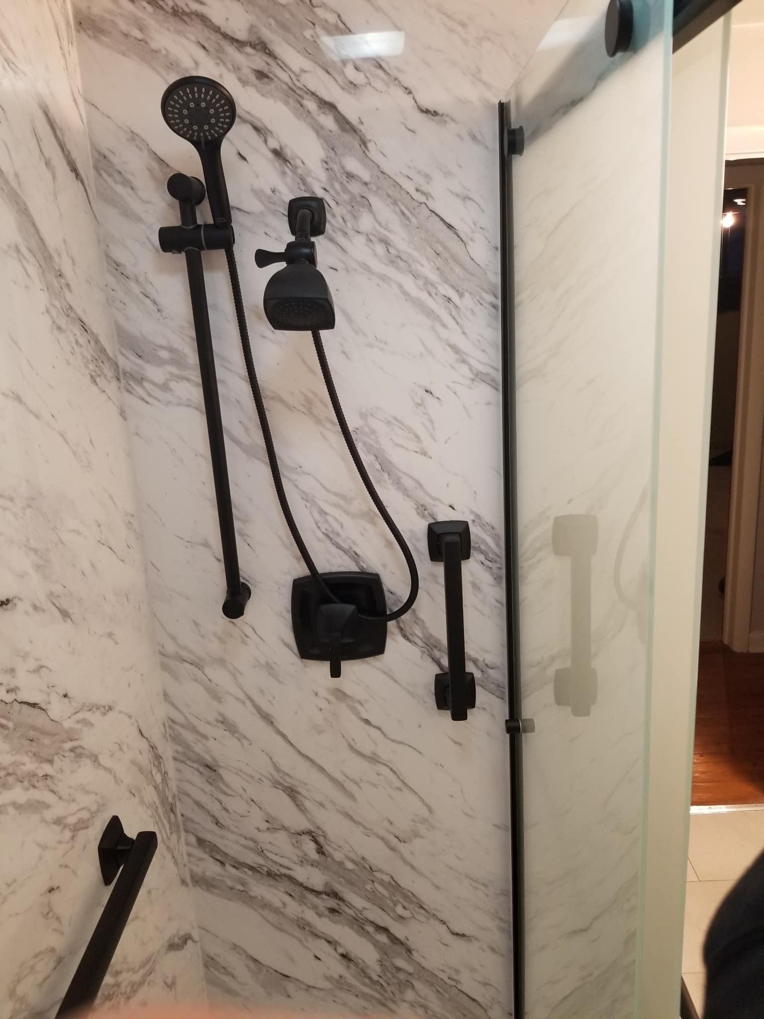 BATHROOM REMODELING NEAR ME DAYTON OHIO Venatino Marble Wall System Matte Black Fixtures